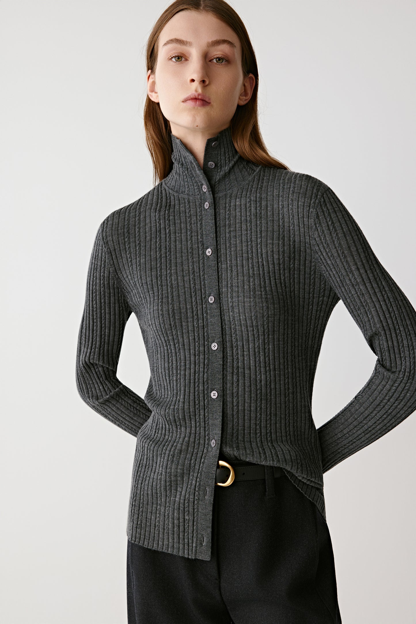 Three-quarter view highlighting the slim fit and vertical rib knit structure.