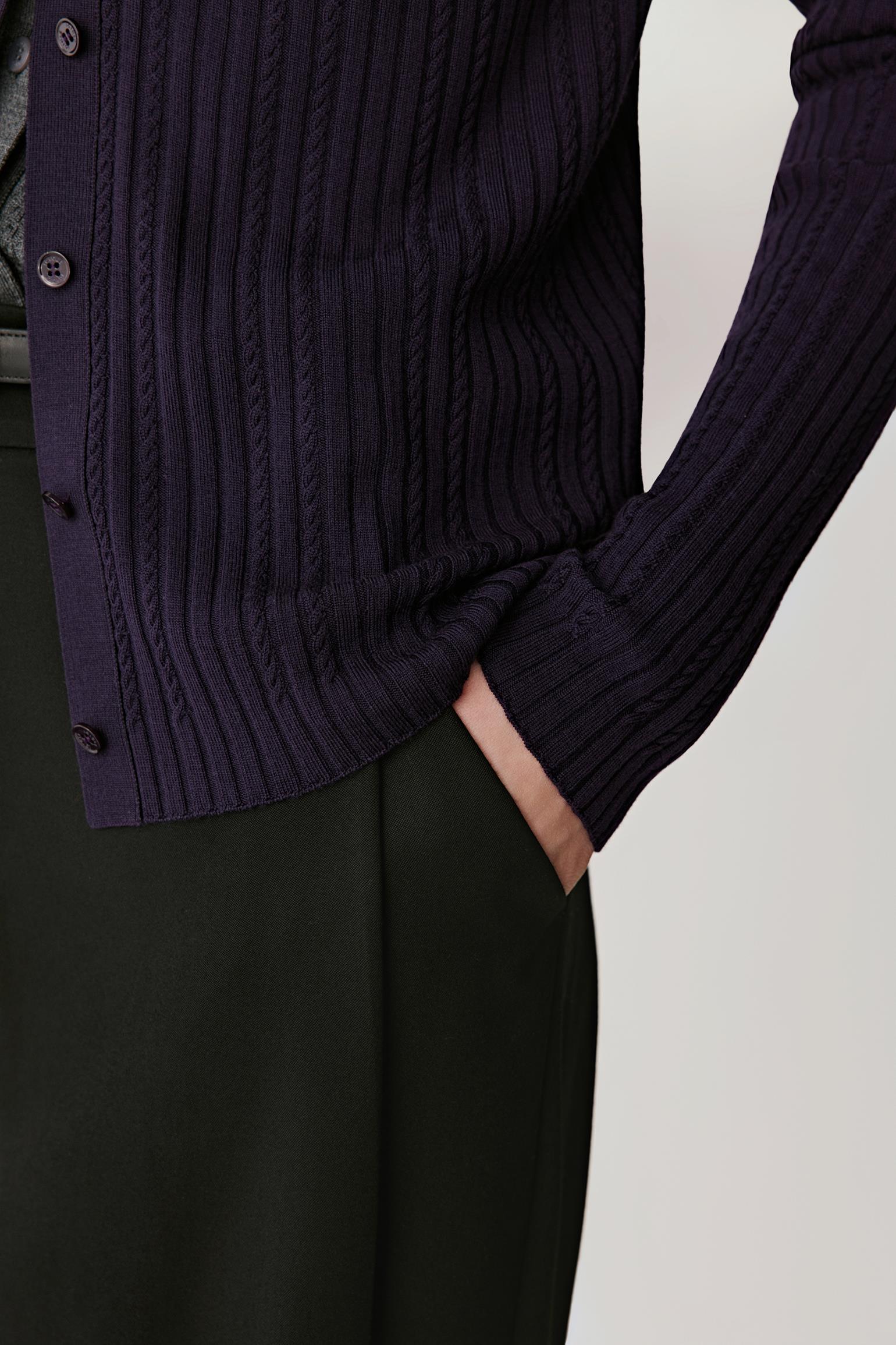 Detail shot of the pocket and fine ribbed hem finish.