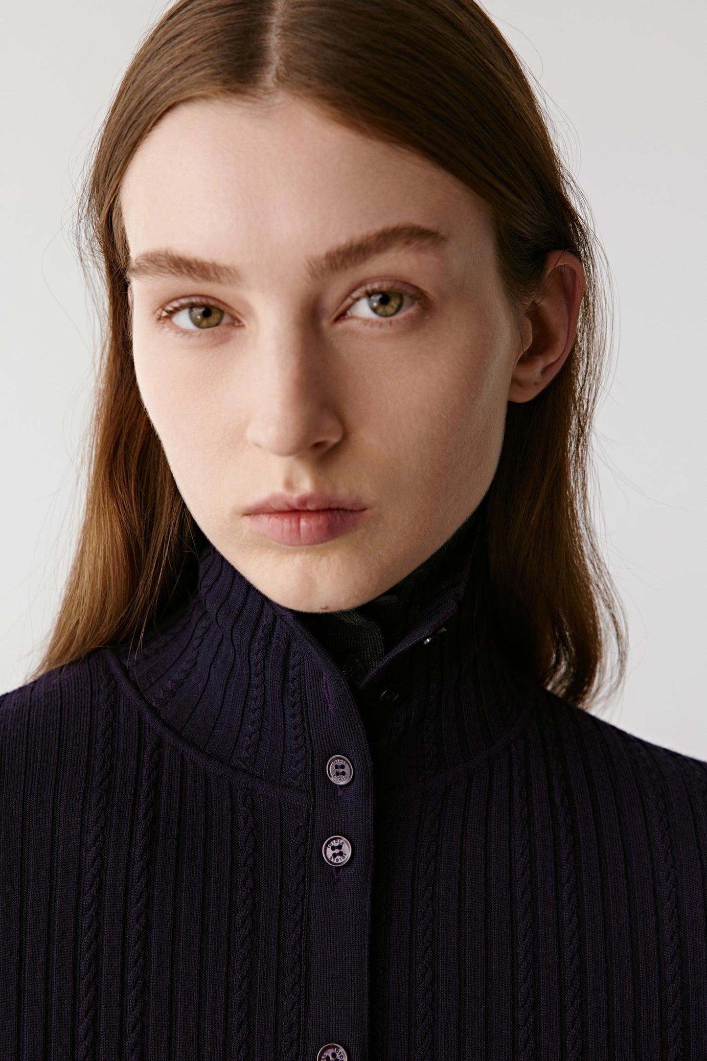 Close-up portrait highlighting the wool texture and subtle sheen of the fabric.