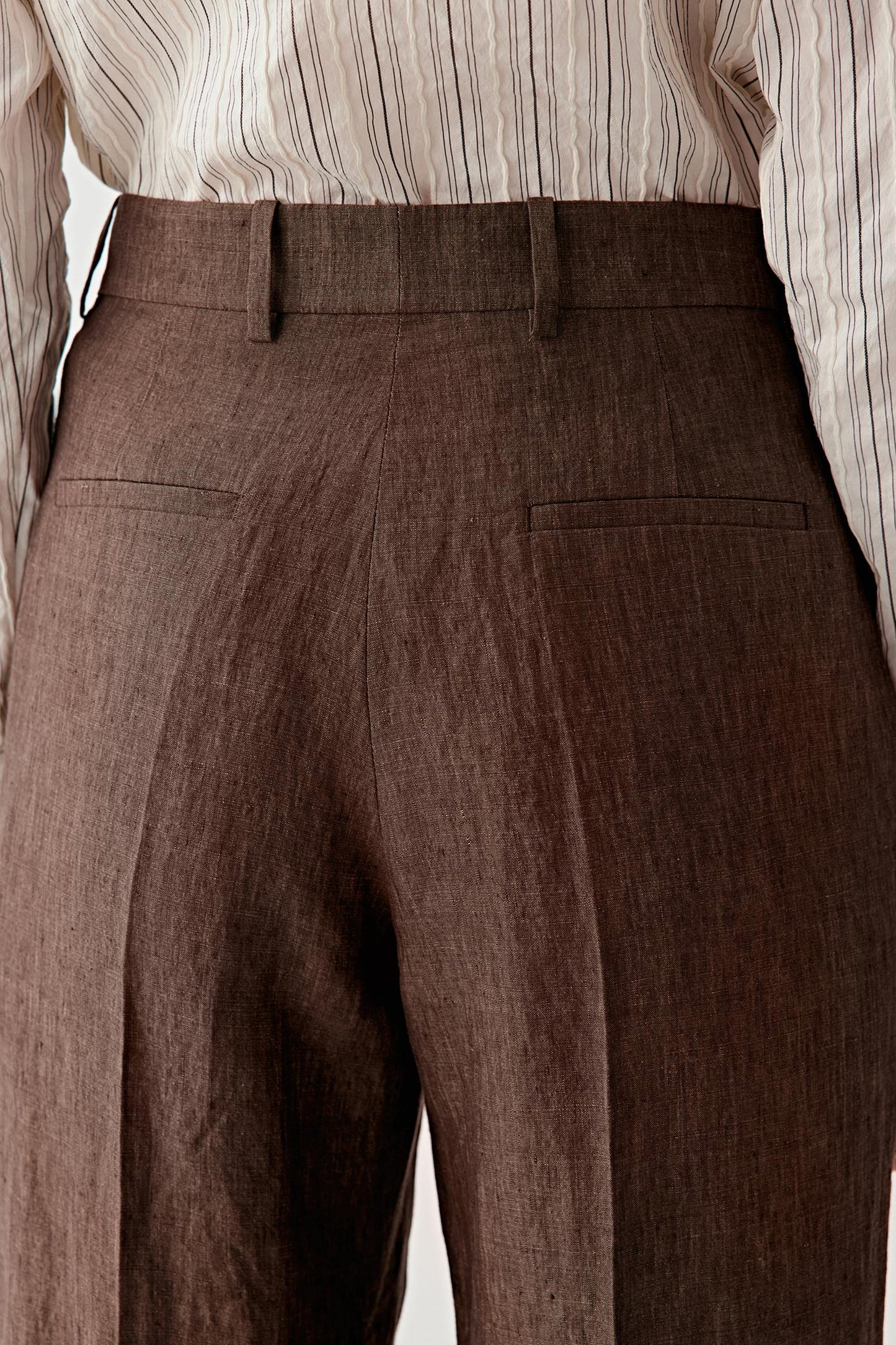 Close-up of fabric showing the natural weave, subtle irregularities and matte finish typical of linen