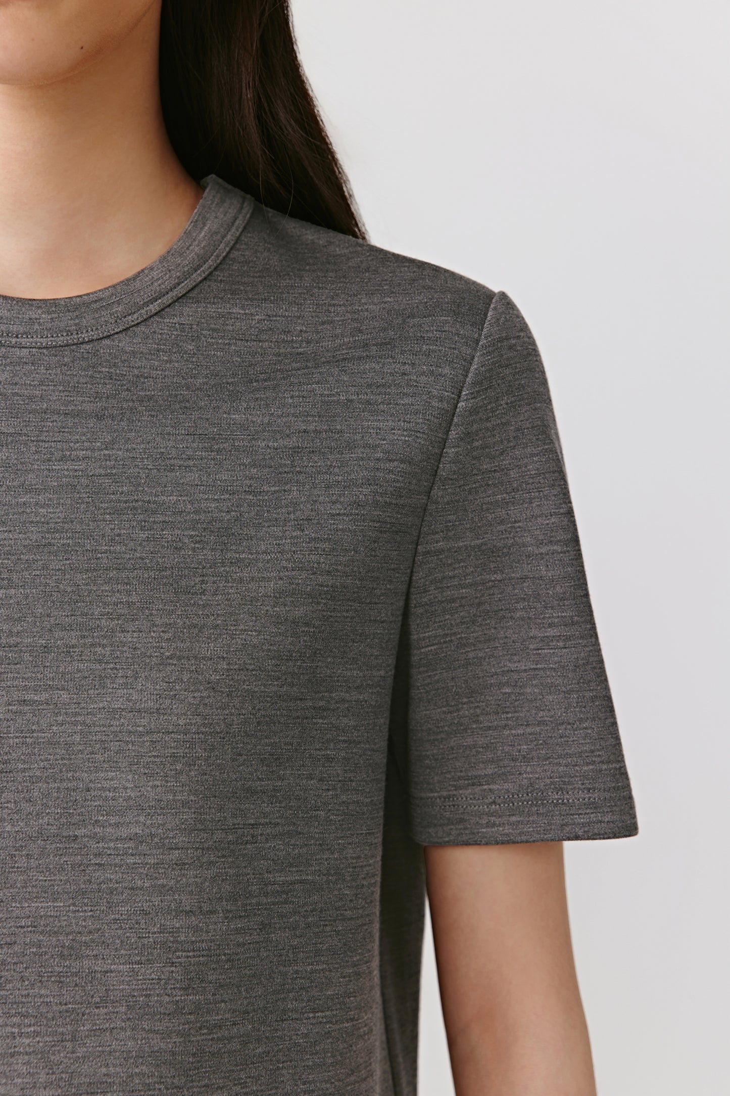 A close-up reveals the brushed finish and natural fibre texture.