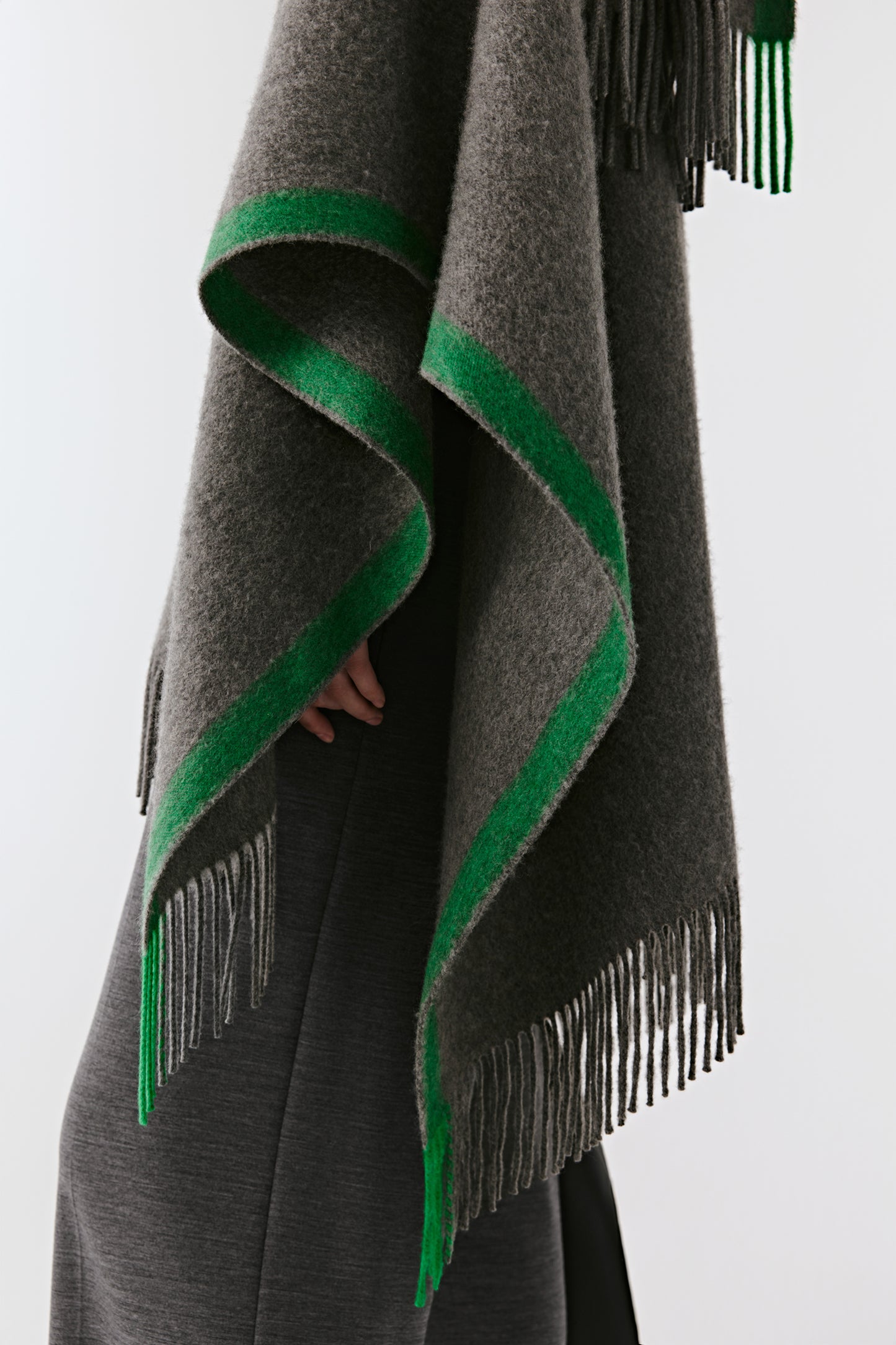 Detail of the edge showing the fine contrasting green border and smooth texture.