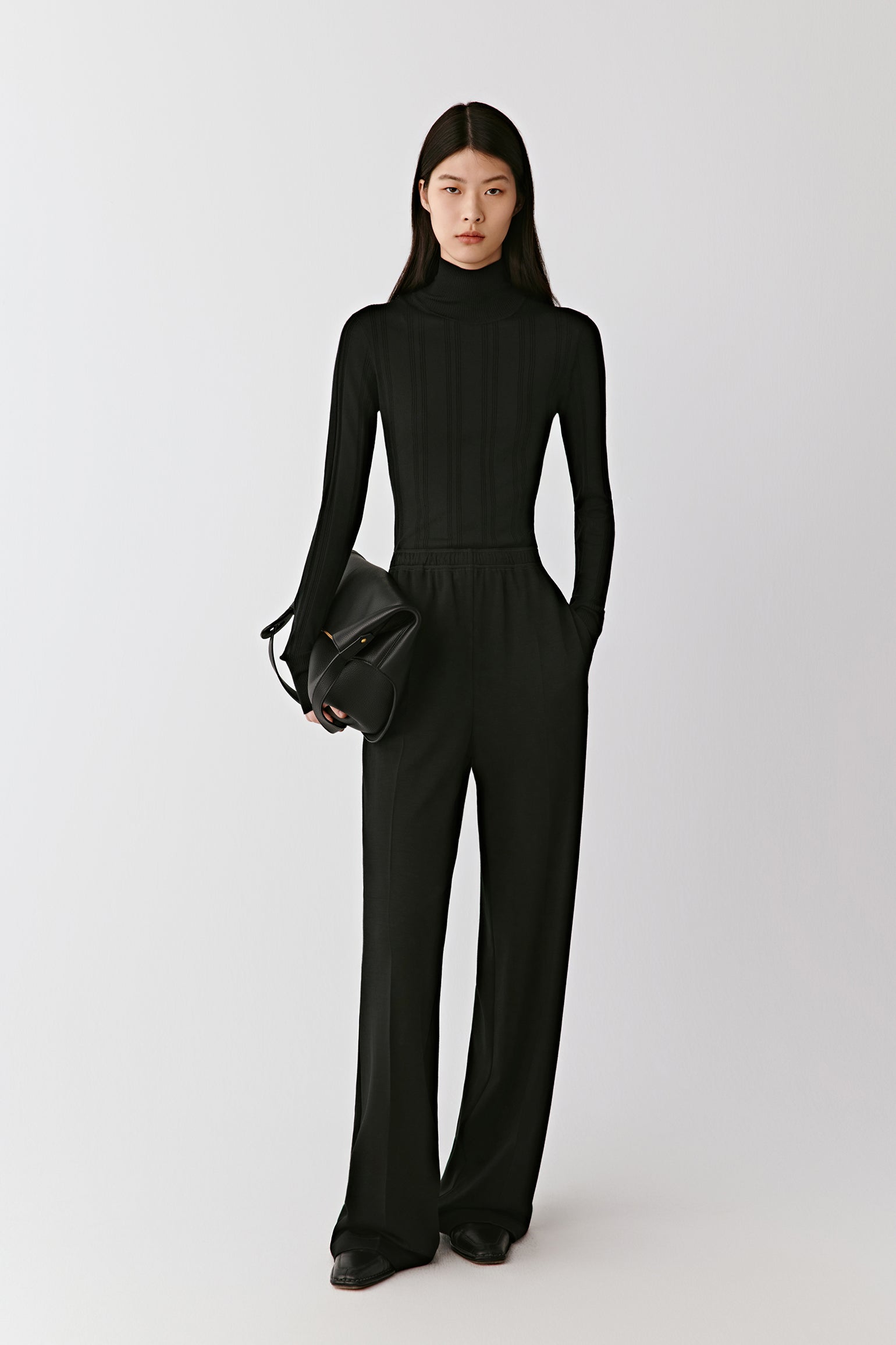 A front view captures the elegant fit and soft stretch of the knit.