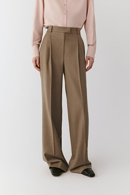 Front view emphasizing the deep pleats, belt loops, and clean waistline