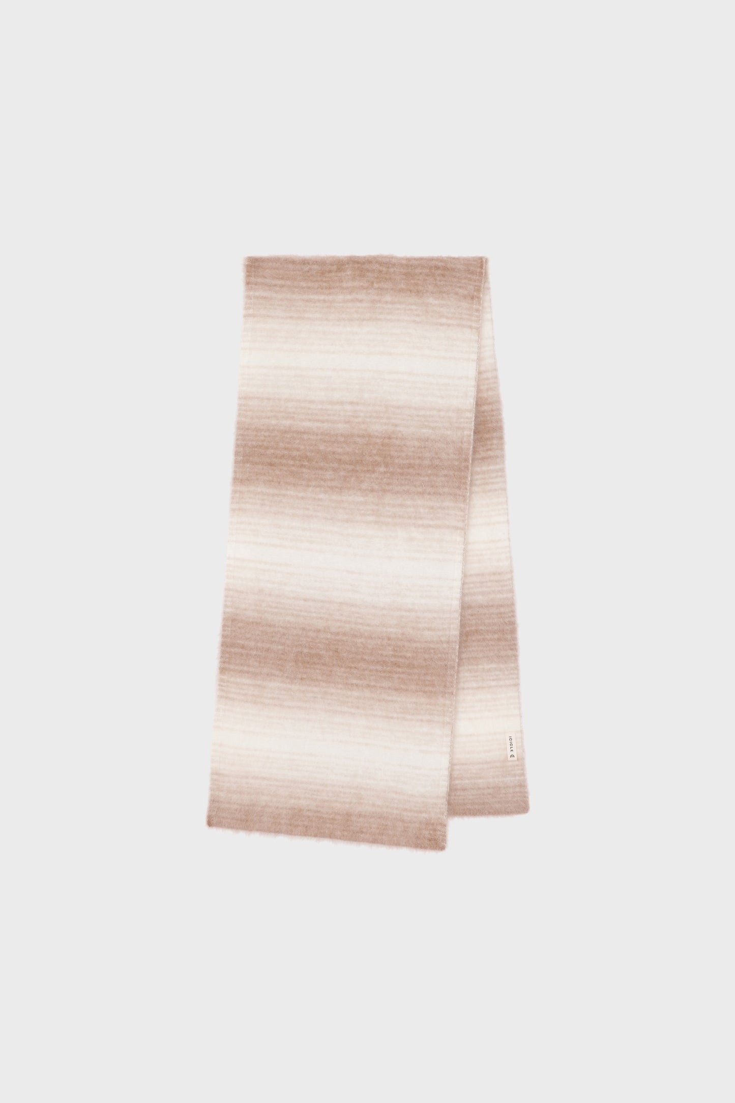 Front view of a long cashmere scarf featuring a subtle camel and beige gradient on a light background.