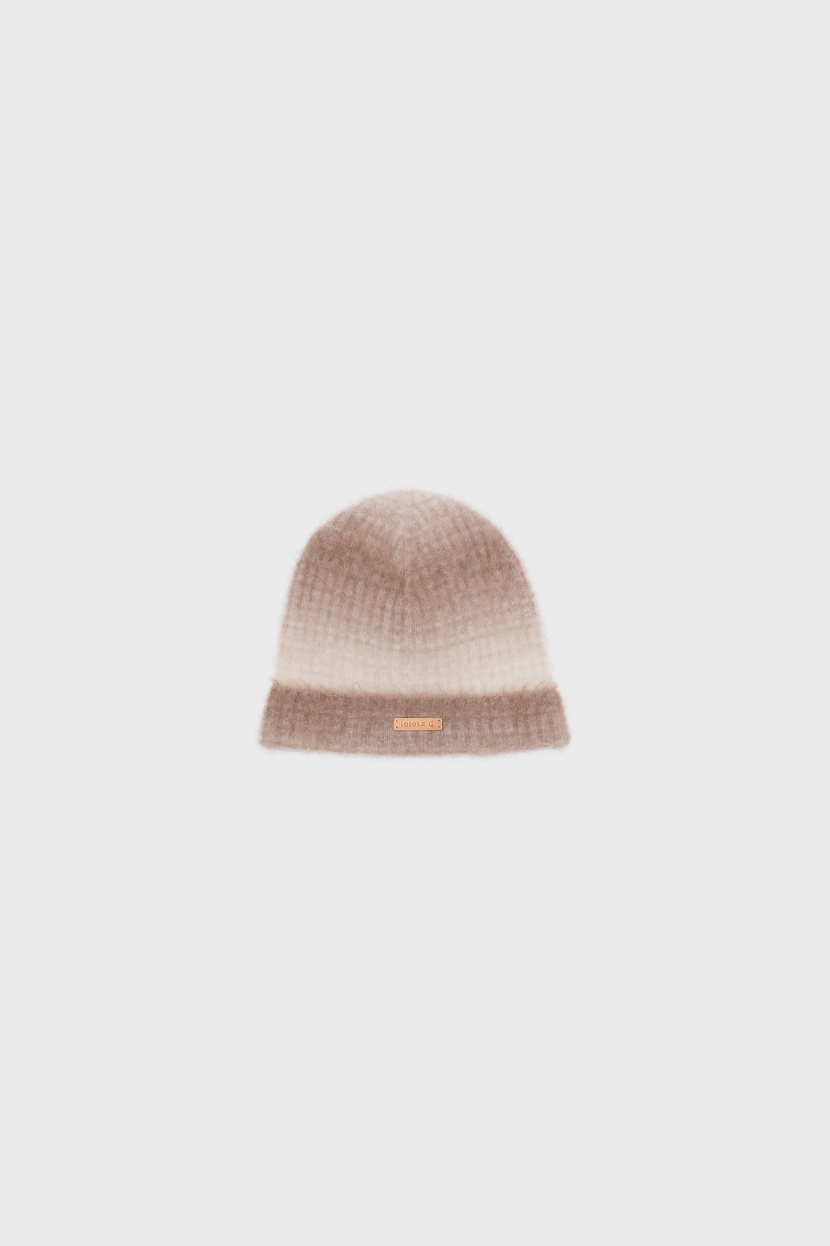 Front view of a cashmere beanie with a soft gradient pattern in camel and light beige, displayed on a neutral background.