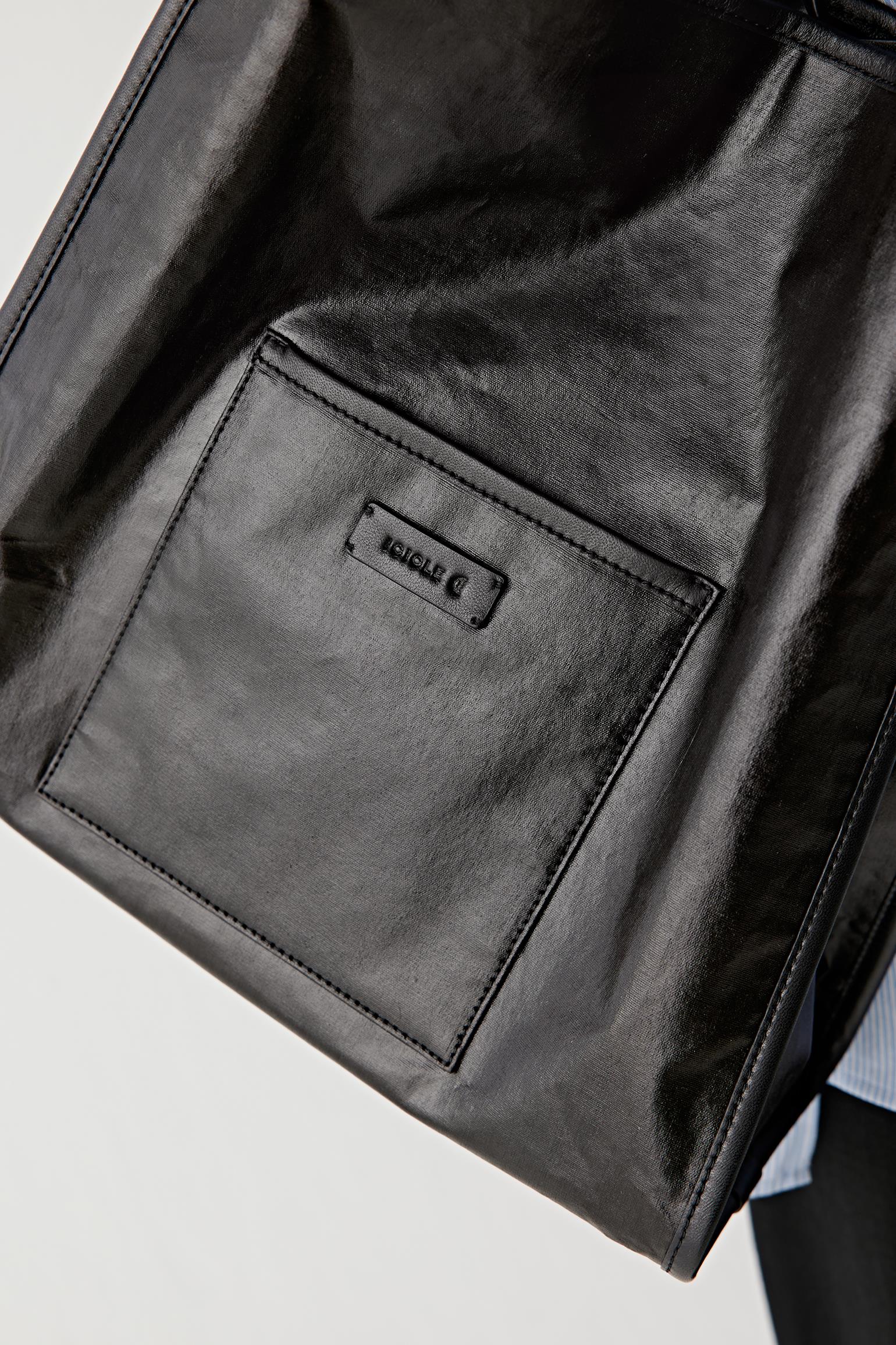 Close-up of leather surface showing grain, stitching, edges and refined finishing
