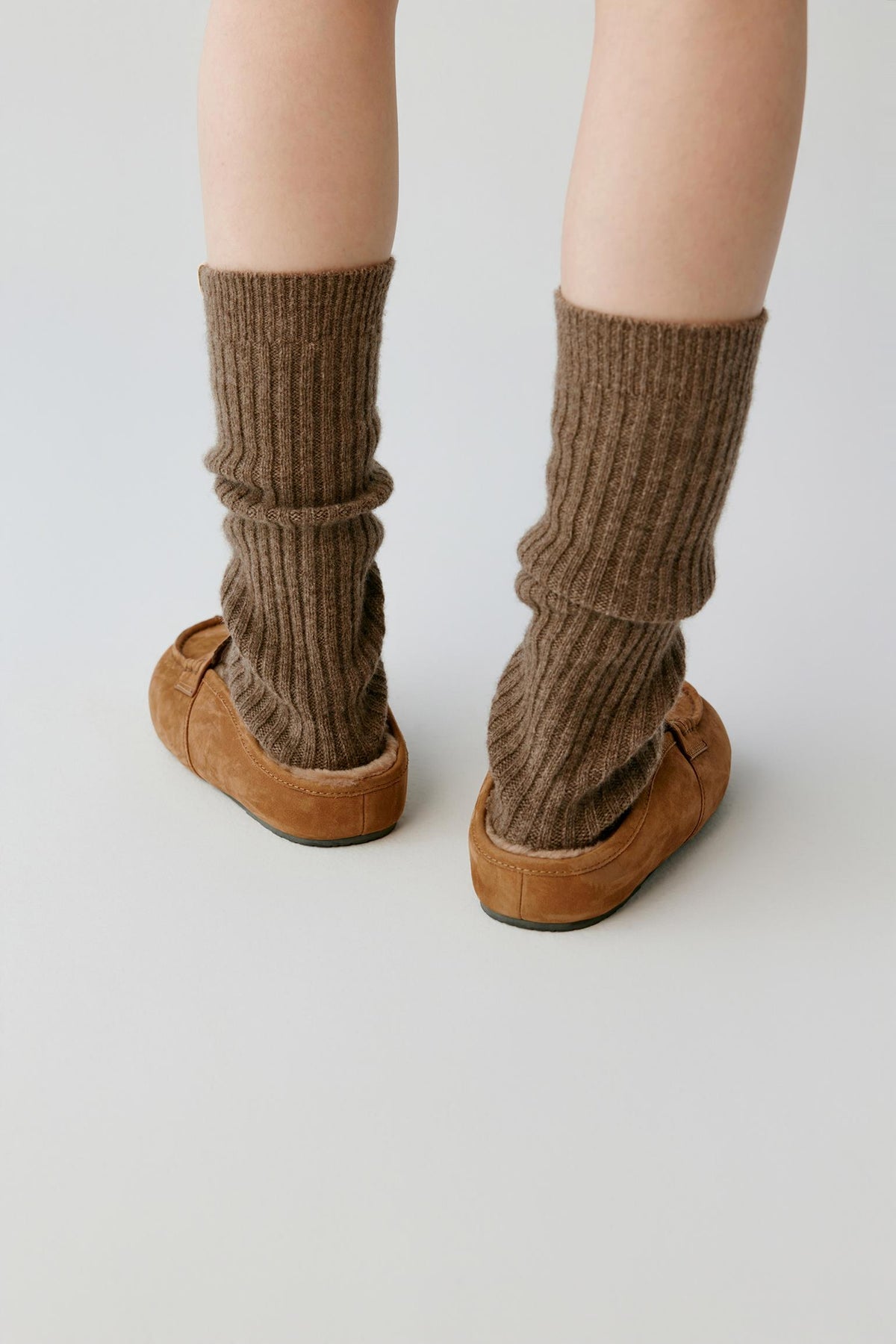 Back view of the chestnut brown nubuck mules, showing the open heel and low-profile silhouette.