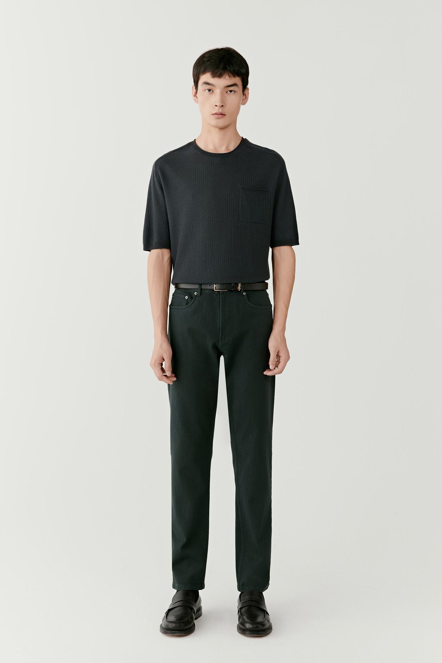 Full-length front view highlighting the straight silhouette, even drape and balanced proportions with matching trousers.