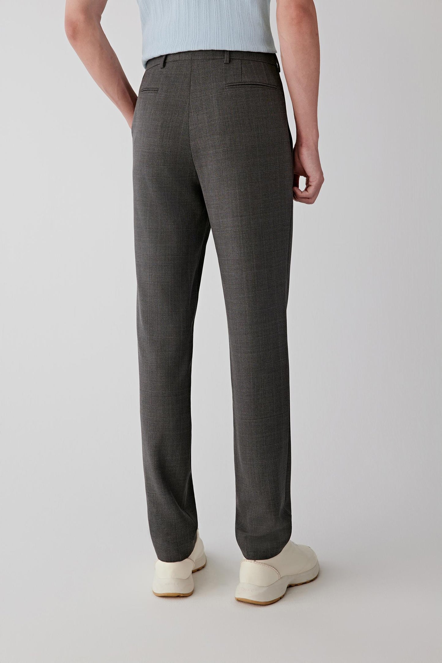 Back view showing the tailored fit and subtle check pattern.