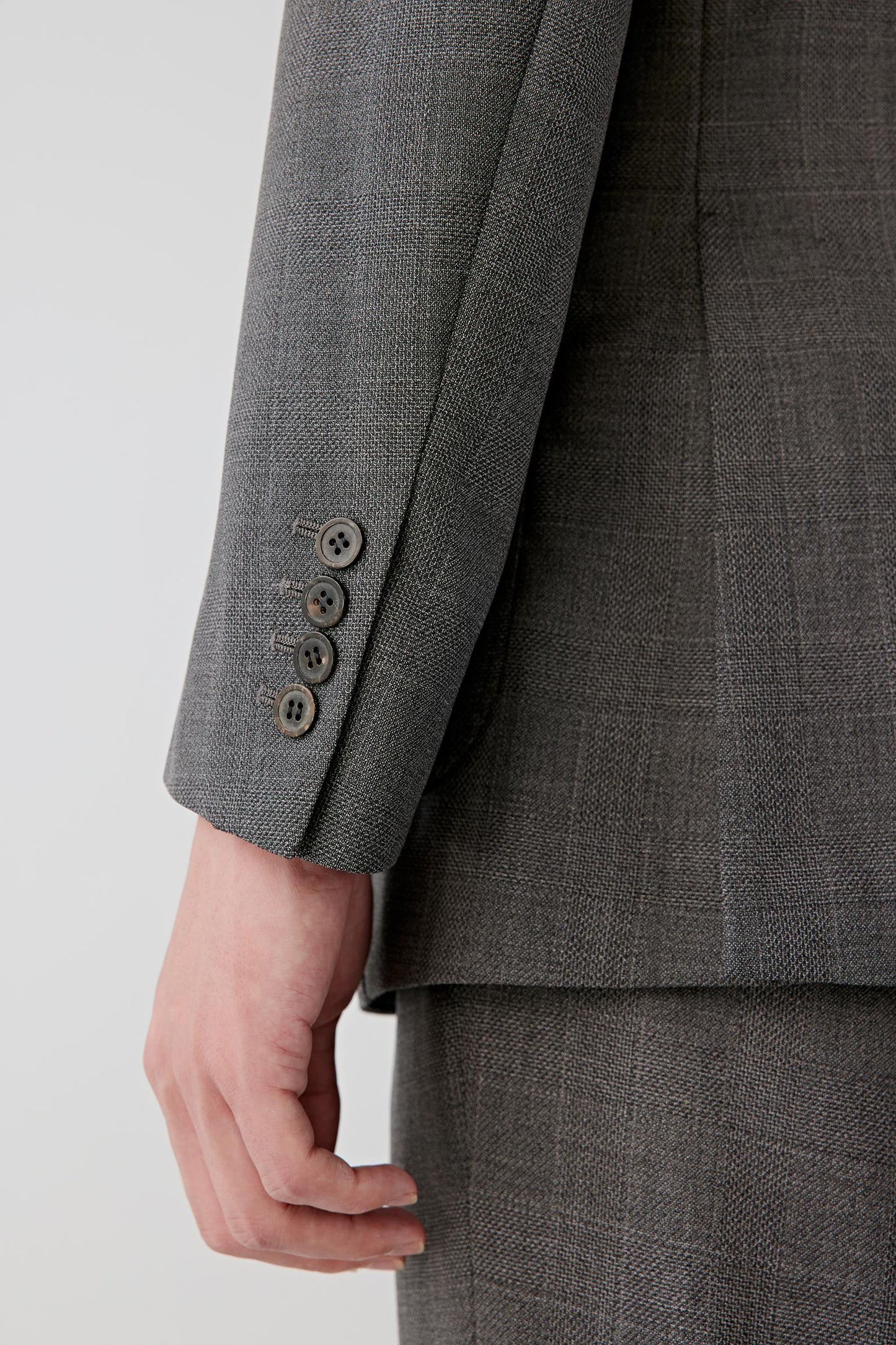 Sleeve detail showing the twill texture and tailored finish.