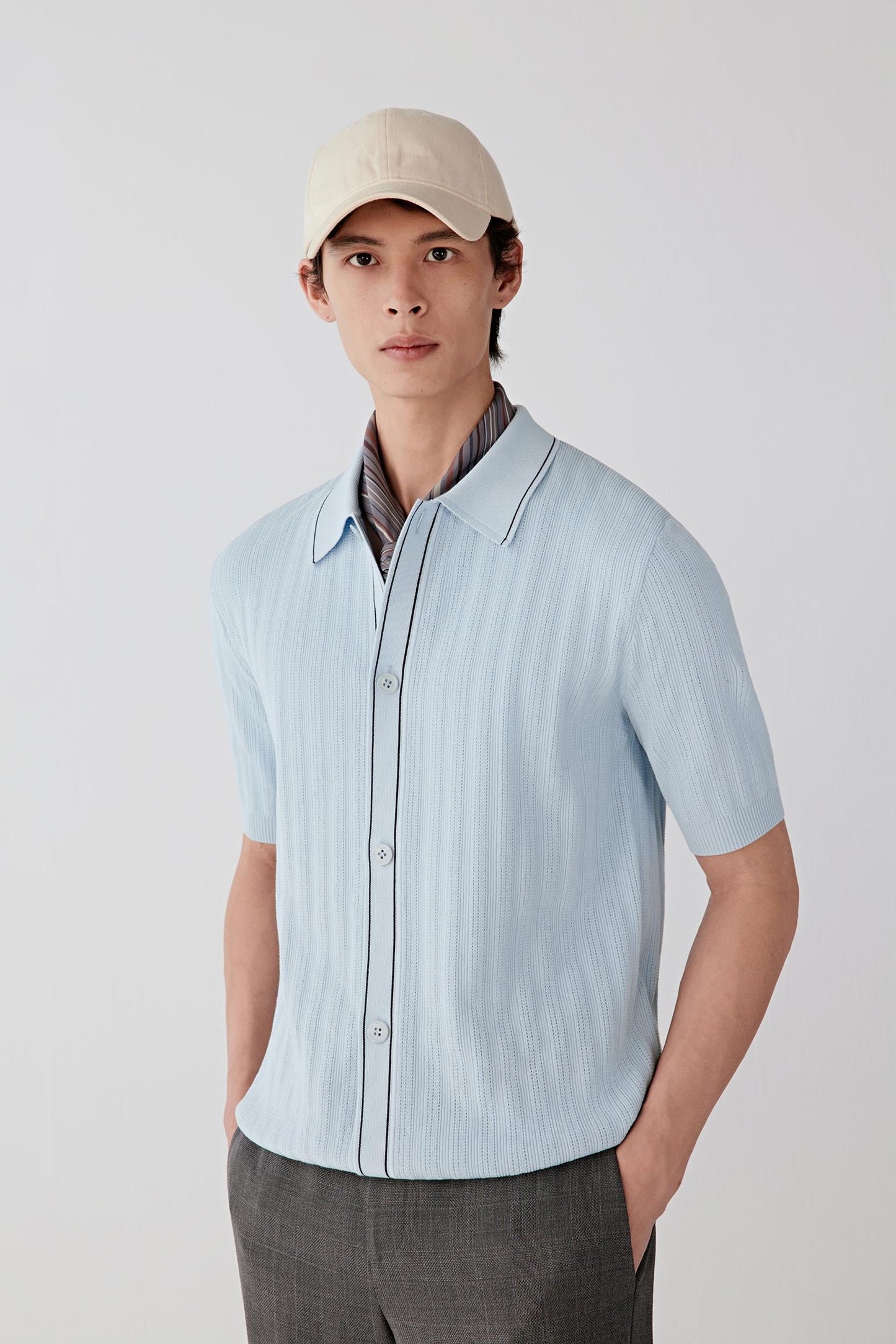 Three-quarter front view showing the fluid drape and lightweight knit structure.