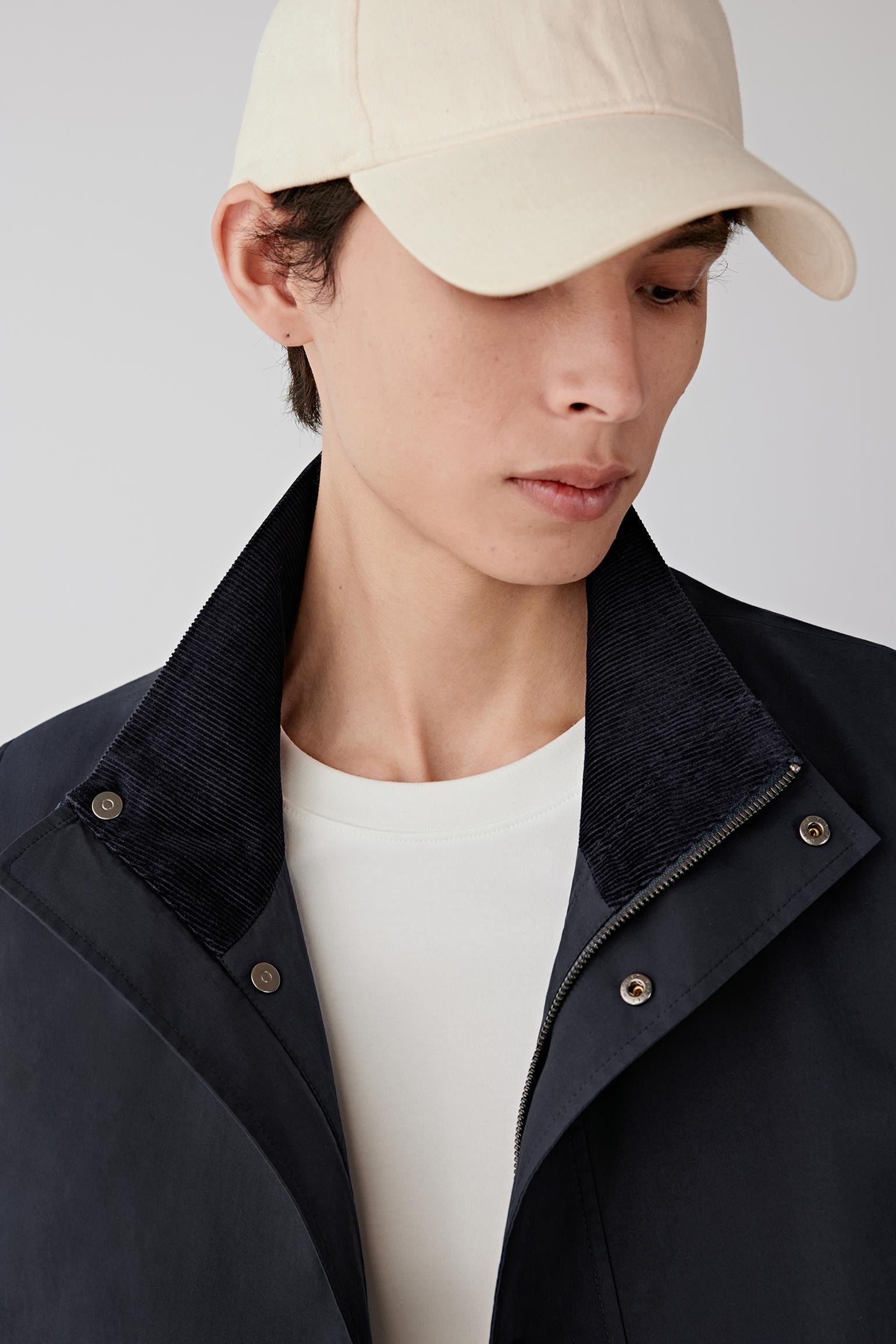 Close-up of the collar and inner lining, revealing contrast texture and construction.