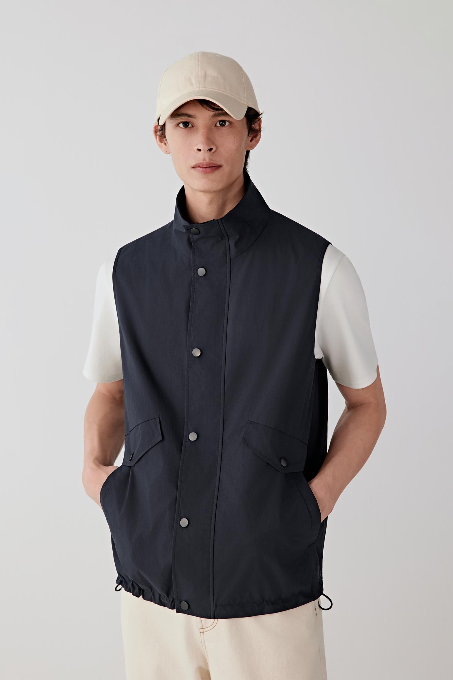 Three-quarter front view highlighting the stand collar and structured yet lightweight fabric.