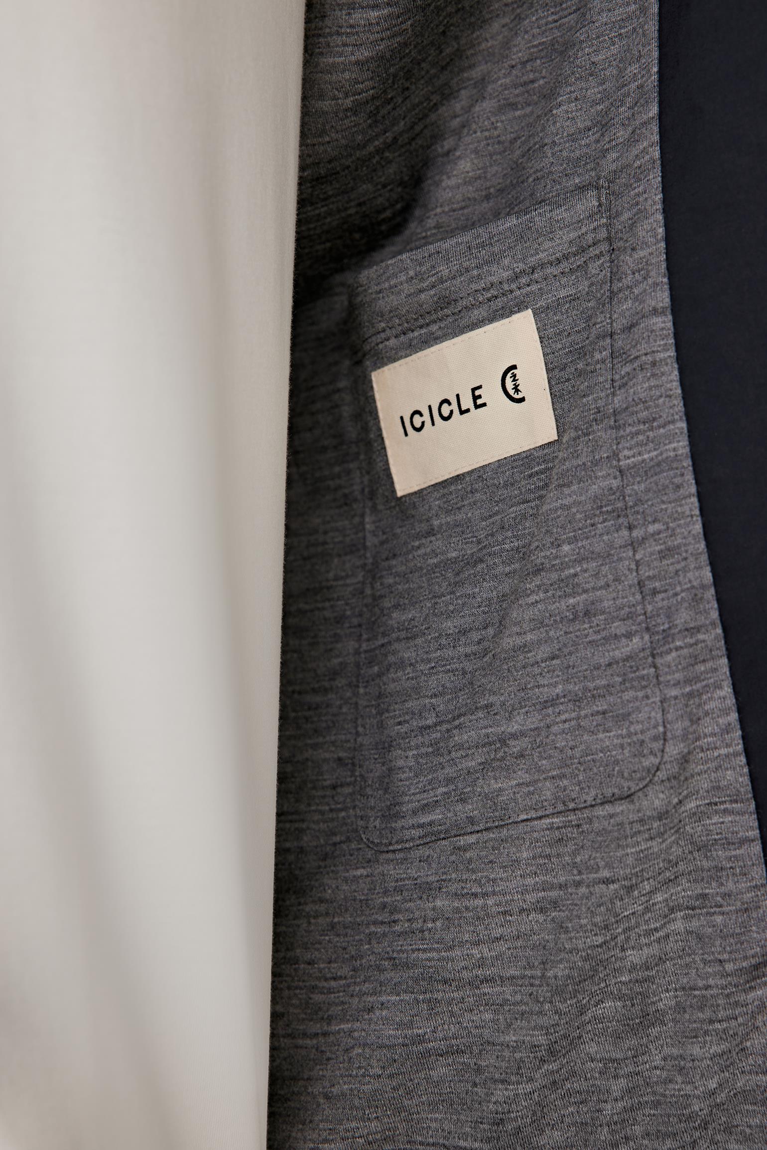 Detail view of the pocket and fabric, highlighting the smooth poplin weave.