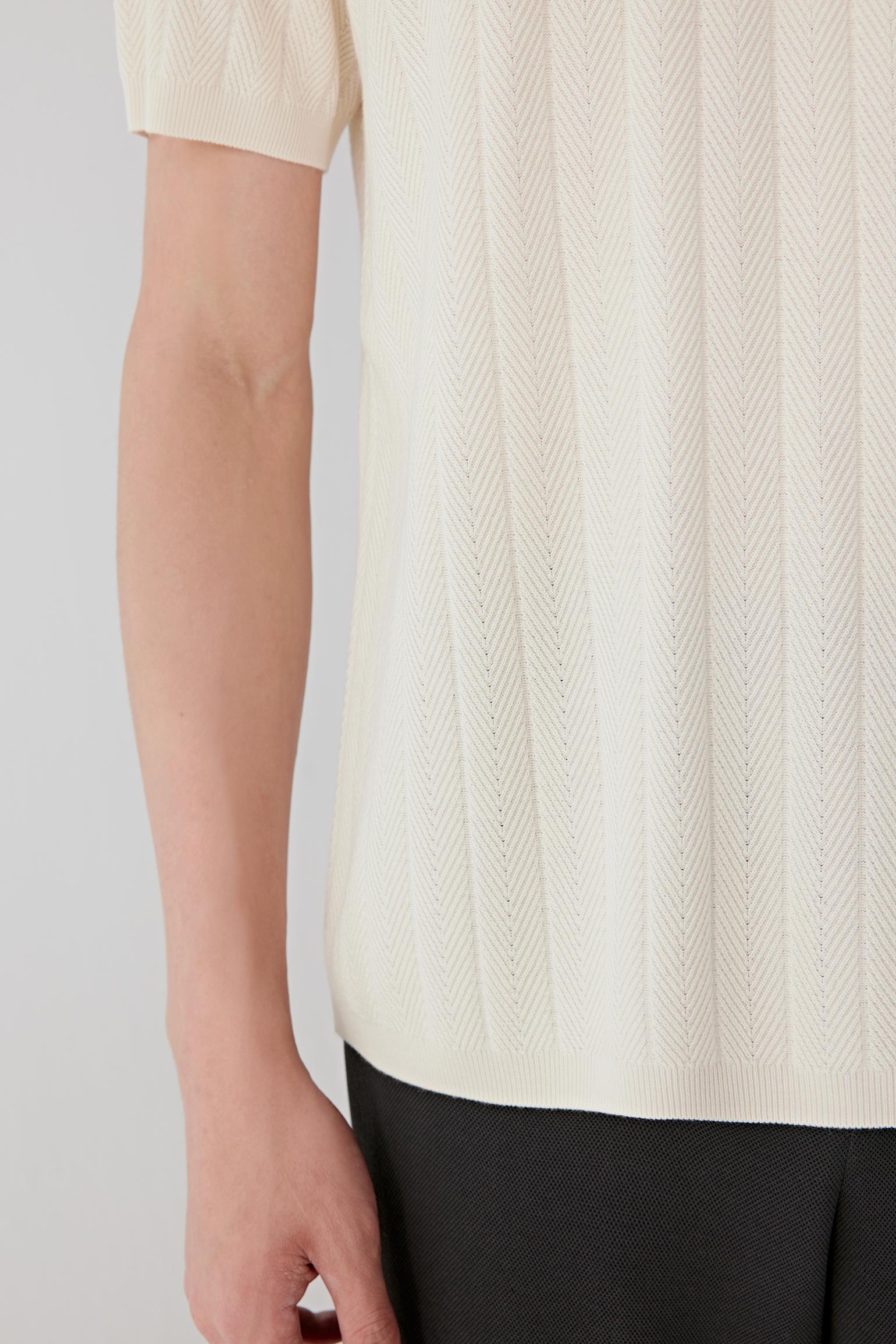 Fabric detail revealing the subtle vertical texture of the silk knit.
