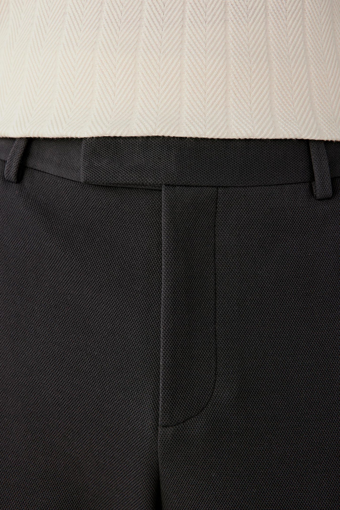 Close-up of the waistband and rear seam.