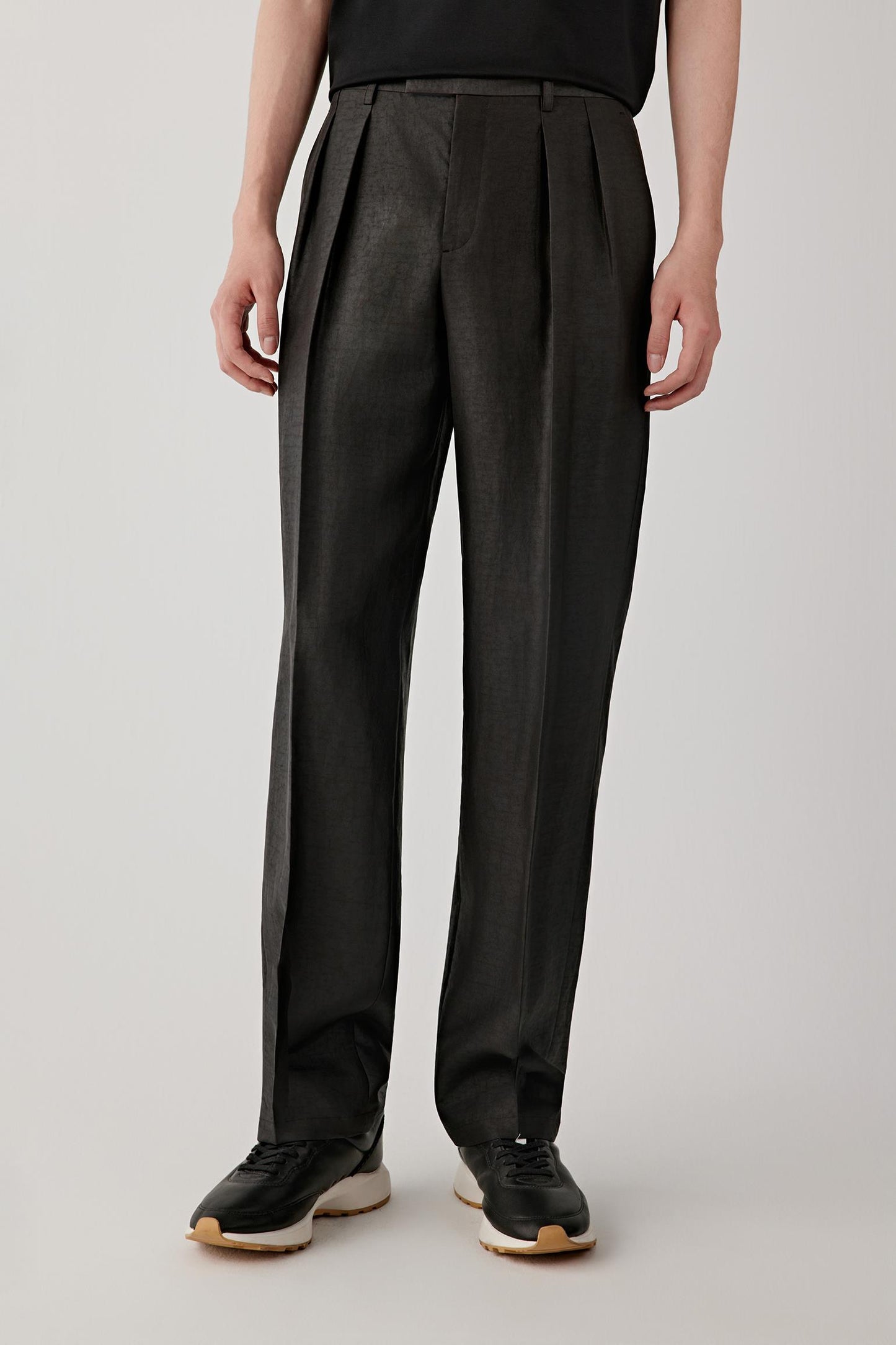 Cropped front view of the trousers highlighting the straight leg cut, clean lines and natural fall from hip to ankle.