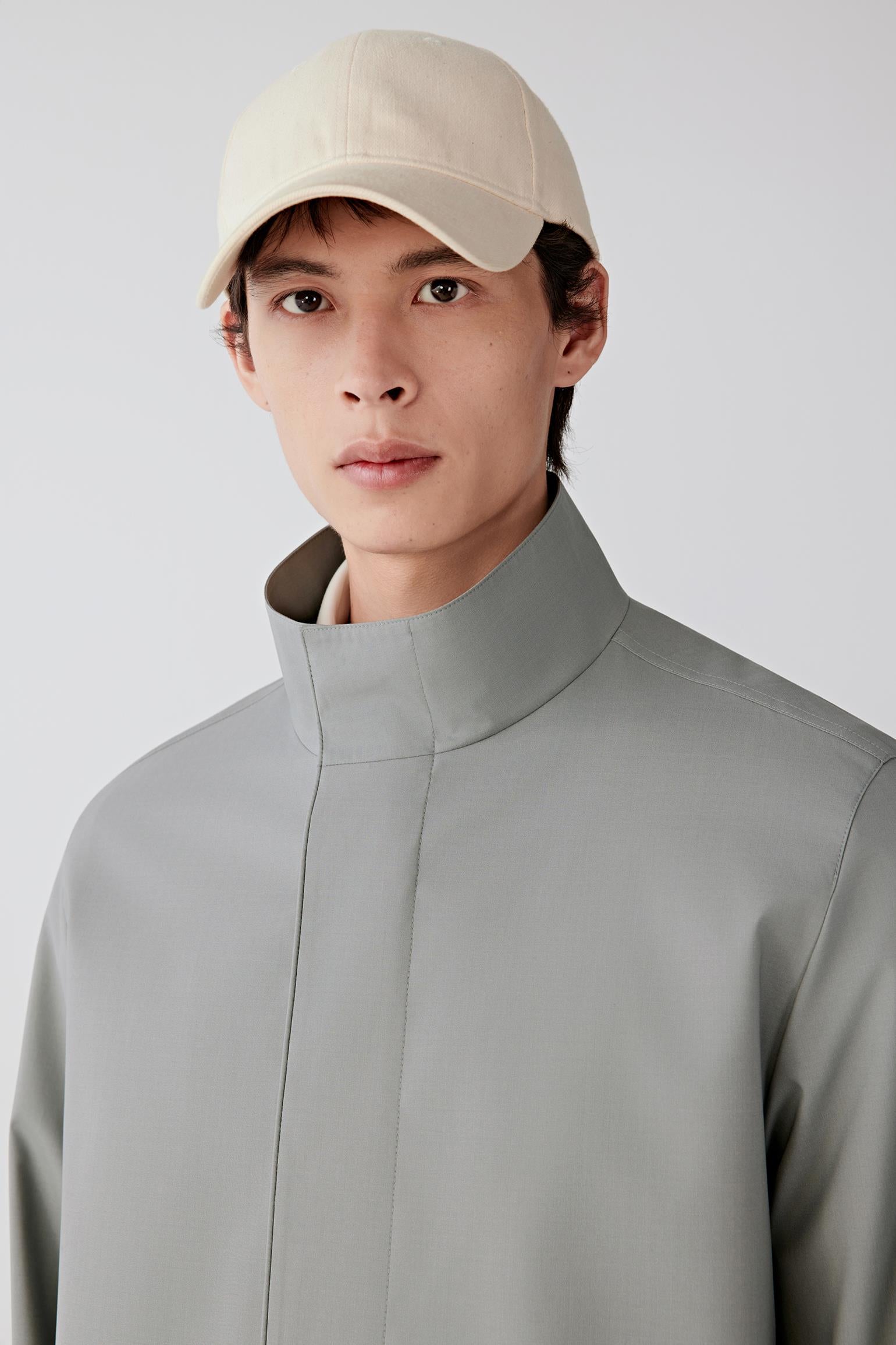 Close-up of the collar and upper chest area, highlighting the smooth matte fabric texture.