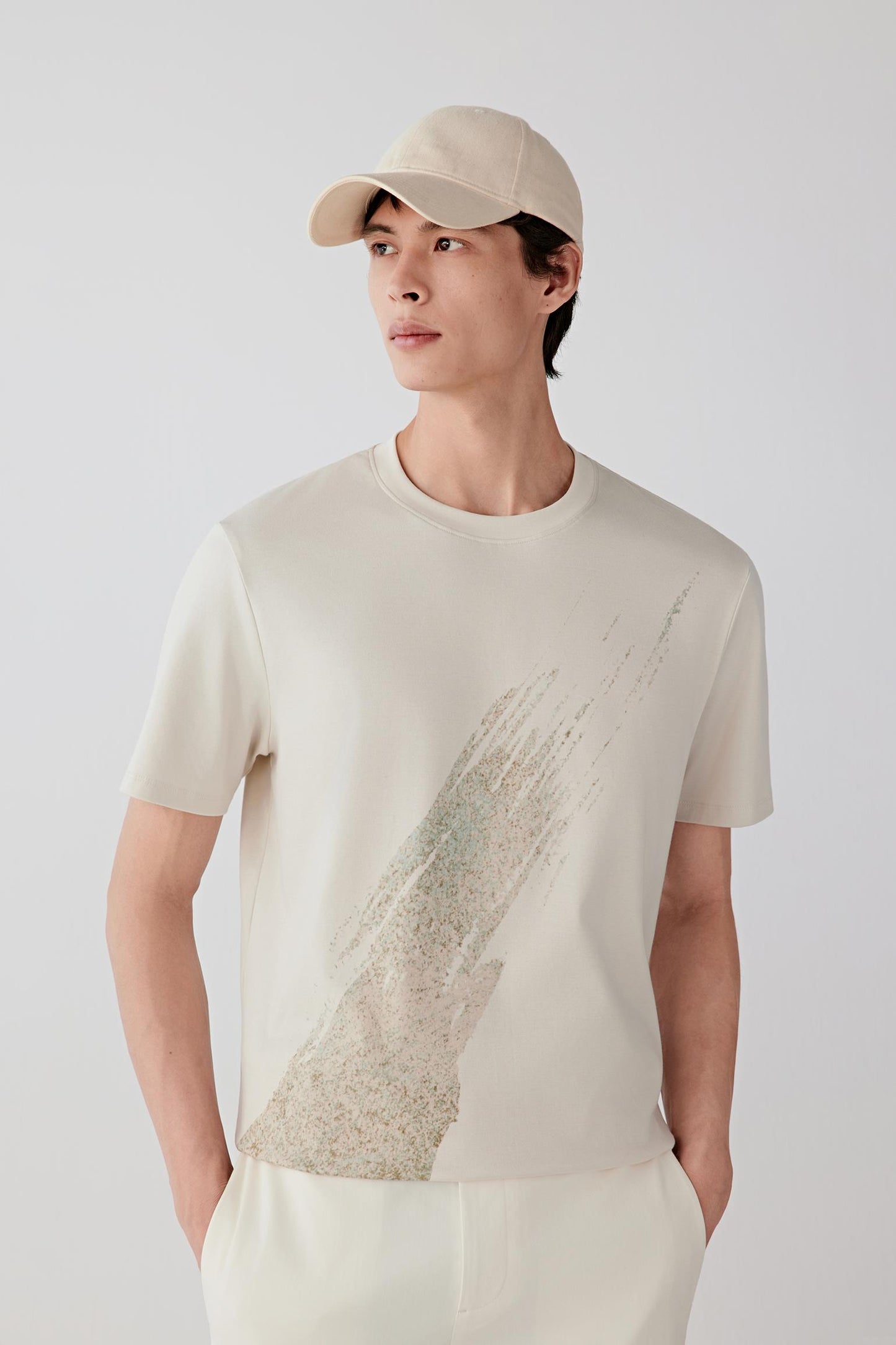 Mid-length front view highlighting the short sleeves, straight cut through the torso and smooth cotton jersey texture.