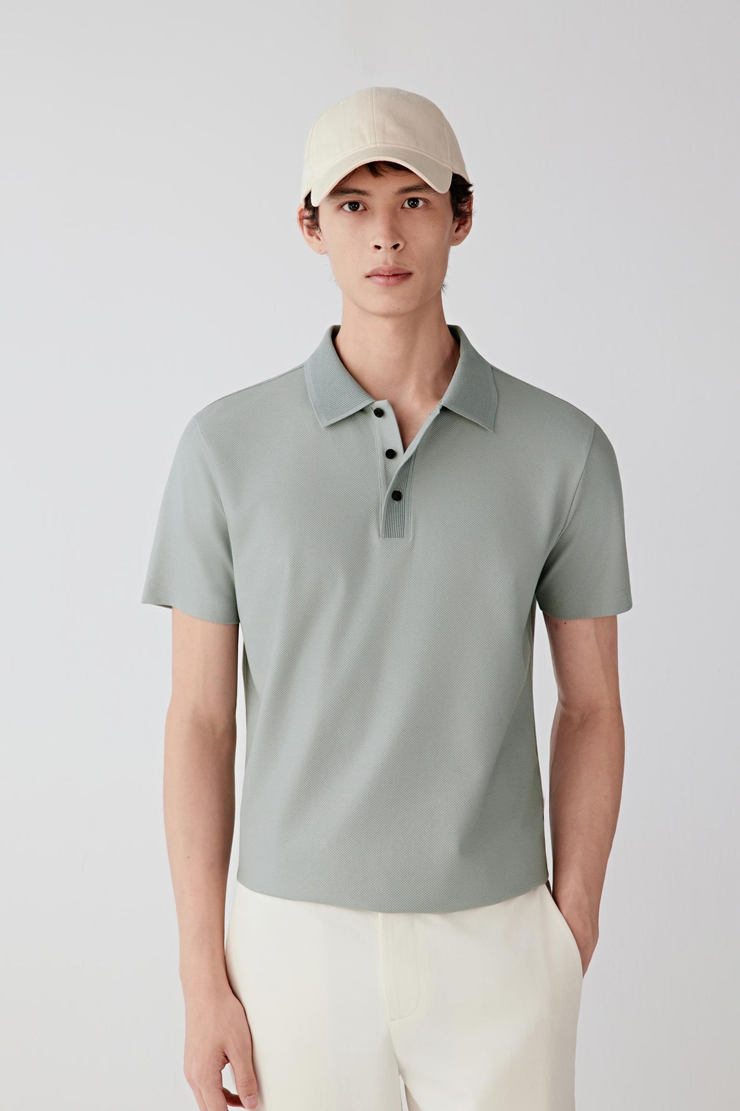 Mid-length front view highlighting the short sleeves, straight cut through the body and smooth, lightweight fabric.