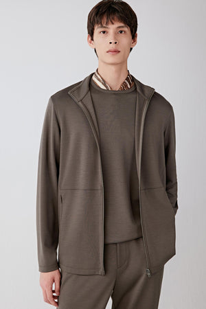 Front portrait view highlighting the shirt collar, zip fastening and smooth Ponte de Roma wool texture in warm brown.