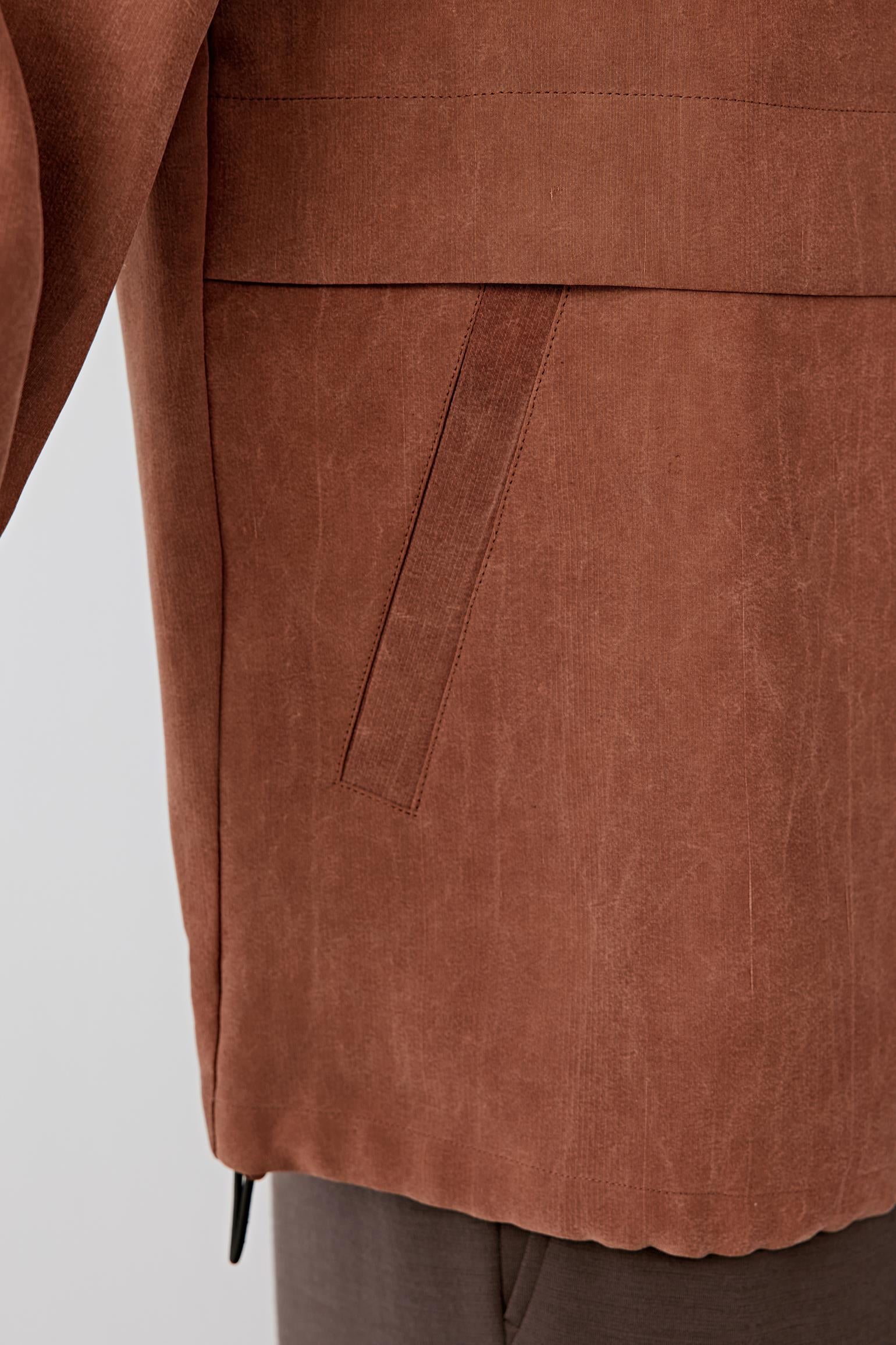 Detail of sleeve and fabric surface, revealing subtle texture and natural finish.