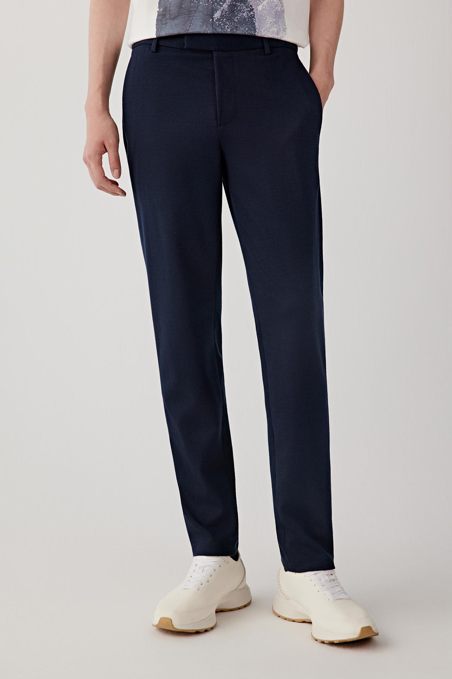Front view focused on the leg shape, highlighting the straight cut, slight taper toward the ankle and smooth drape of the fabric.