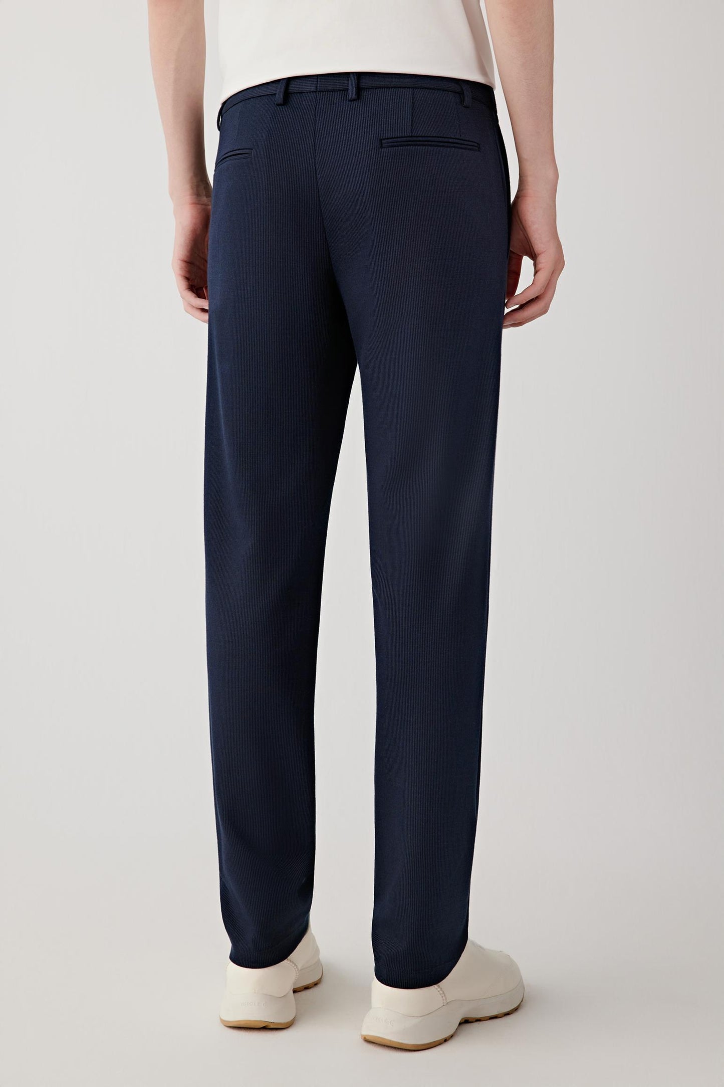 Back view showing the straight cut, clean back panel and minimal pocket detailing, maintaining a refined, understated look.