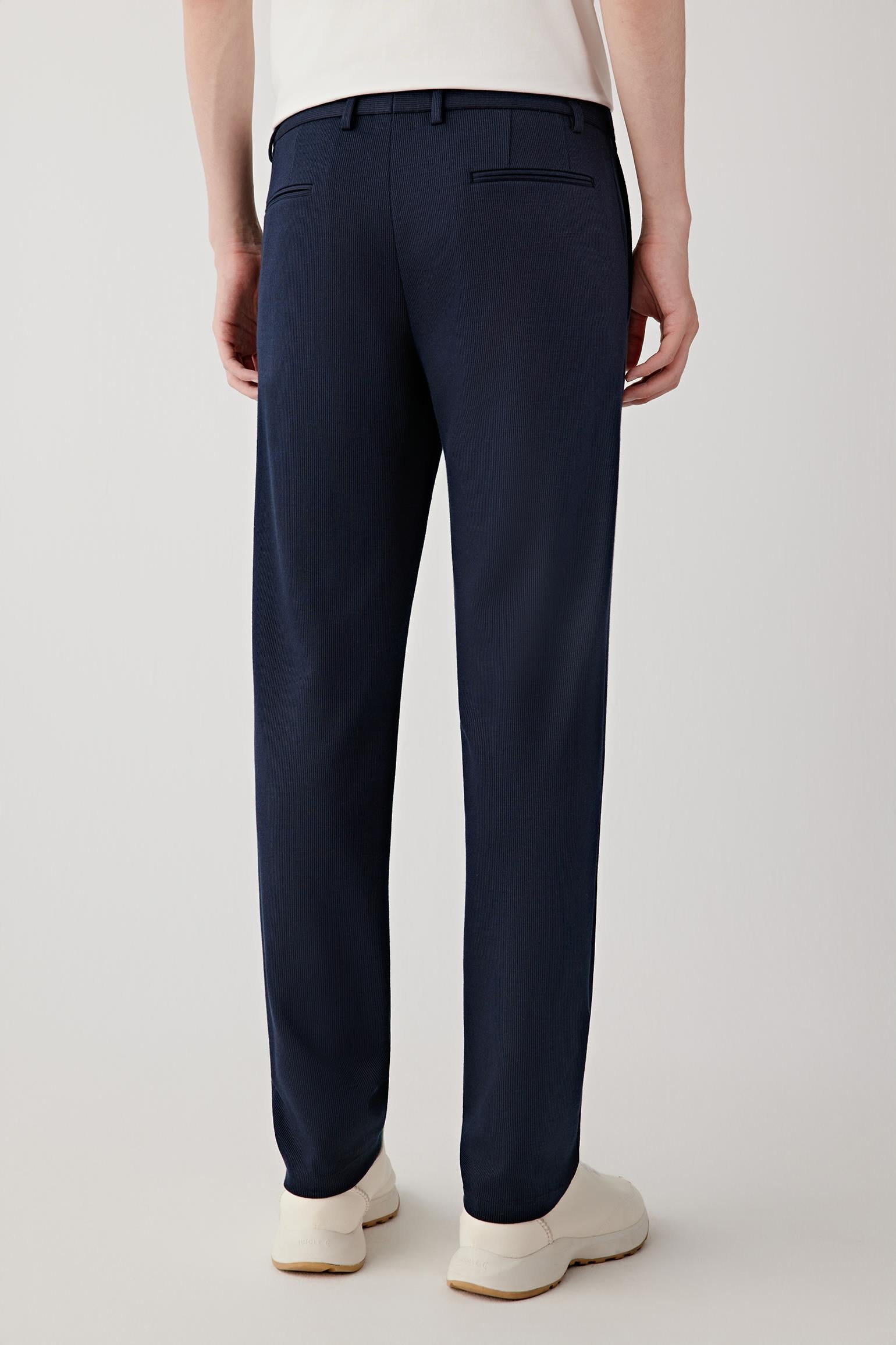 Back view showing the straight cut, clean back panel and minimal pocket detailing, maintaining a refined, understated look.