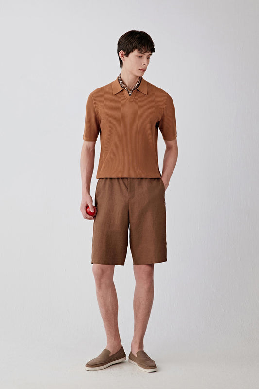 Full-length front view of a man standing facing forward wearing a brown fine spinning cotton pullover paired with matching brown shorts, highlighting the monochrome look, straight silhouette and lightweight ribbed knit construction with a soft, matte surface