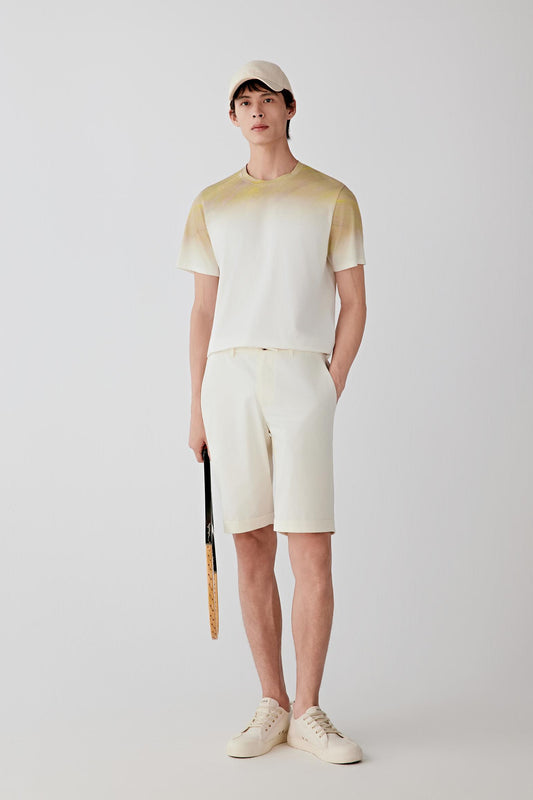 Full-length front view showing the relaxed straight silhouette, round neckline and short sleeve construction. The lightweight cotton jersey falls softly while maintaining a clean and balanced shape.