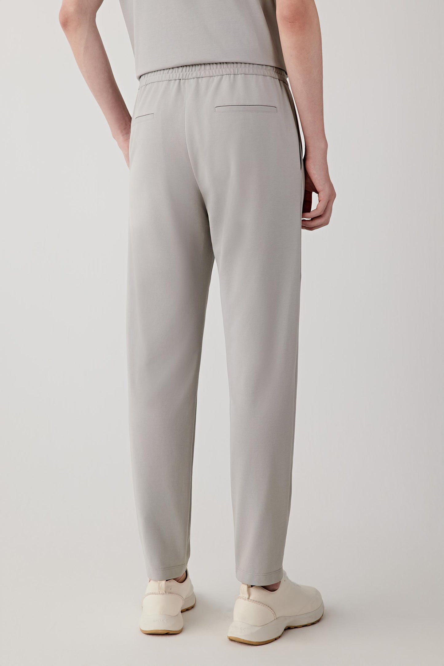 Side or back view emphasizing the fluid line of the straight-leg cut and the lightweight jersey construction. The relaxed silhouette moves naturally with the body.