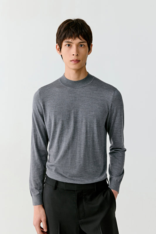 A mid-shot reveals the soft surface of the wool and silk blend as it catches the light.