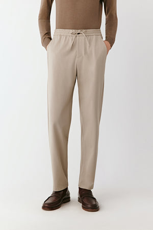 A front close-up captures the fine texture of the piqué cotton and precise stitching.
