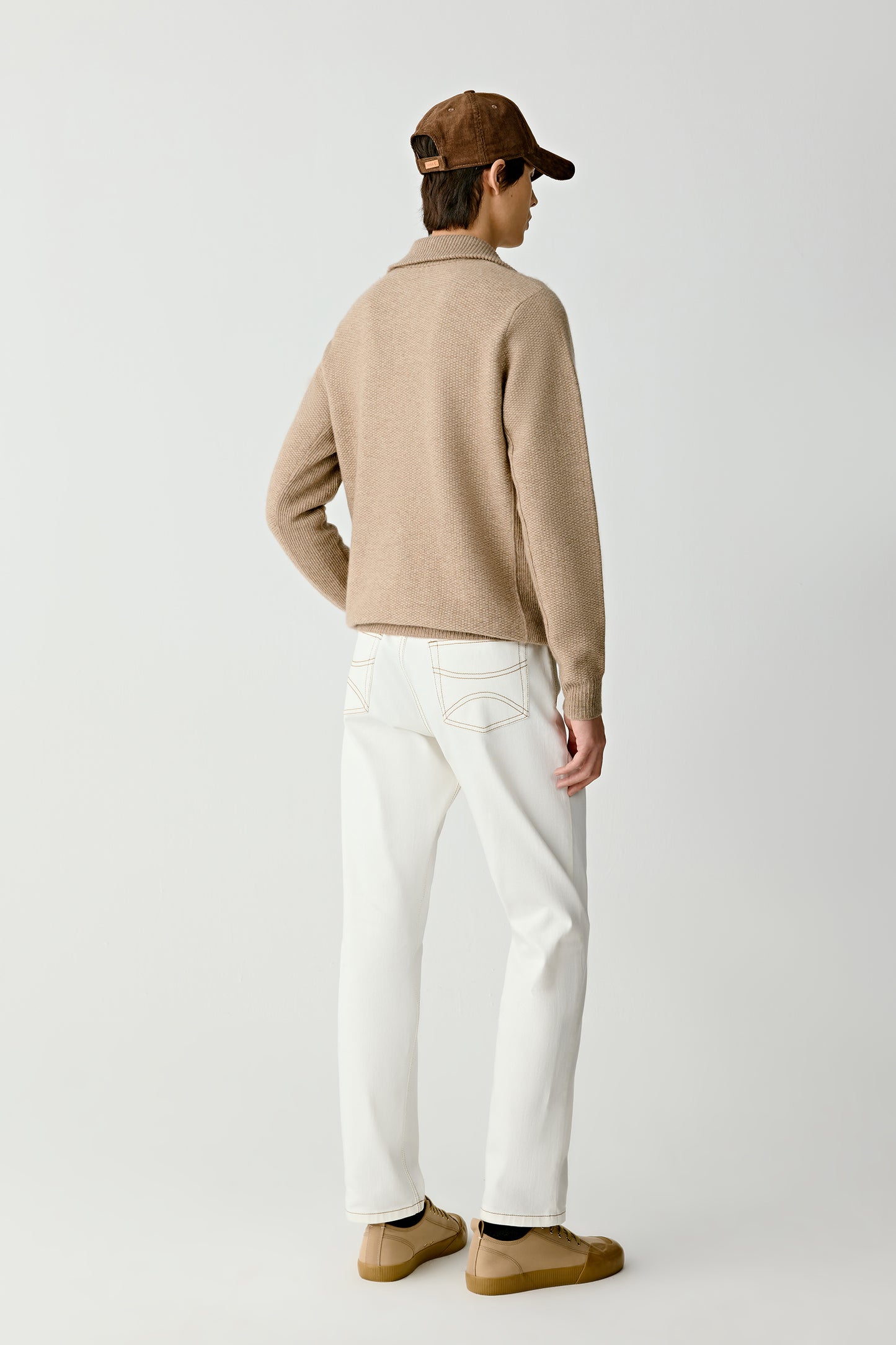 Close-up of the polo zip collar and cuff detail, showing the natural fibre’s softness and finish.