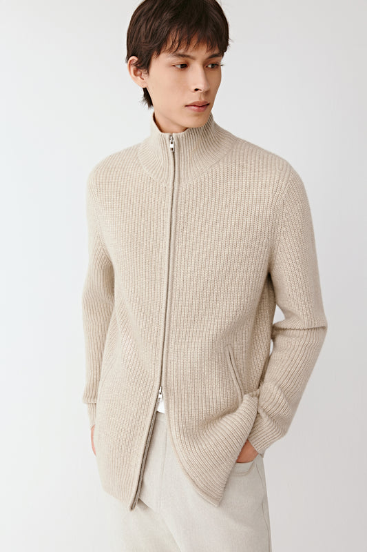 Three-quarter view of the cream  cashmere cardigan, showing the clean silhouette and fine knit texture.
