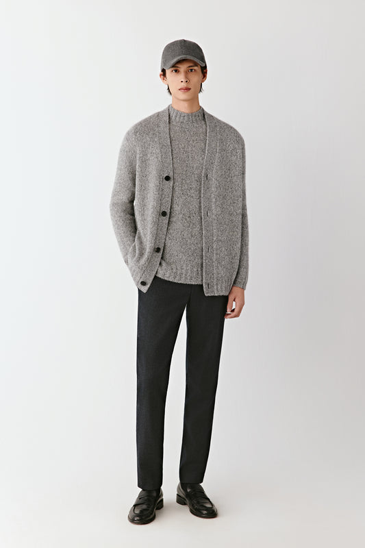 Front view of the grey melange cashmere and silk cardigan, relaxed fit with button fastening and ribbed trims.