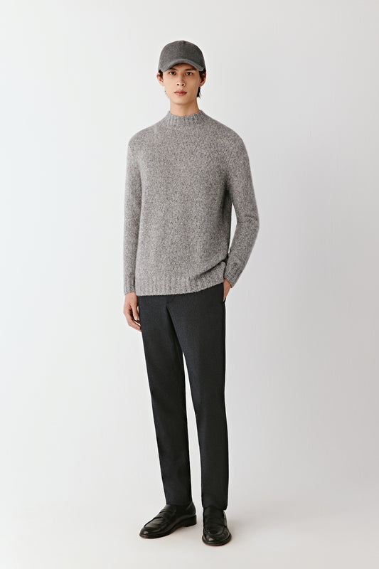 Front view of the grey melange mock-neck pullover in cashmere and silk, straight fit with ribbed trims.