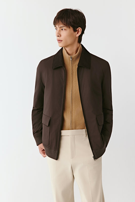 Three-quarter side view of the brown wool and yak jacket, highlighting the straight cut, smooth texture, and relaxed yet structured fit.