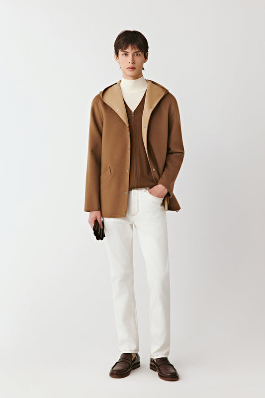 Front view of the camel double-faced merino wool hooded jacket, worn open to reveal the beige interior and soft drape.