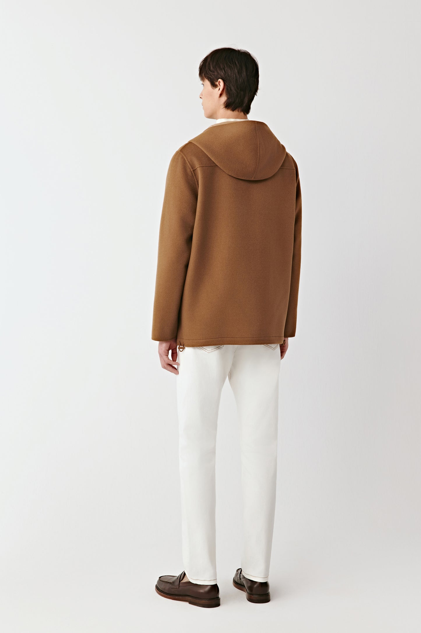 Back view of the double-faced merino wool jacket, showing the smooth construction and natural fall of the fabric.