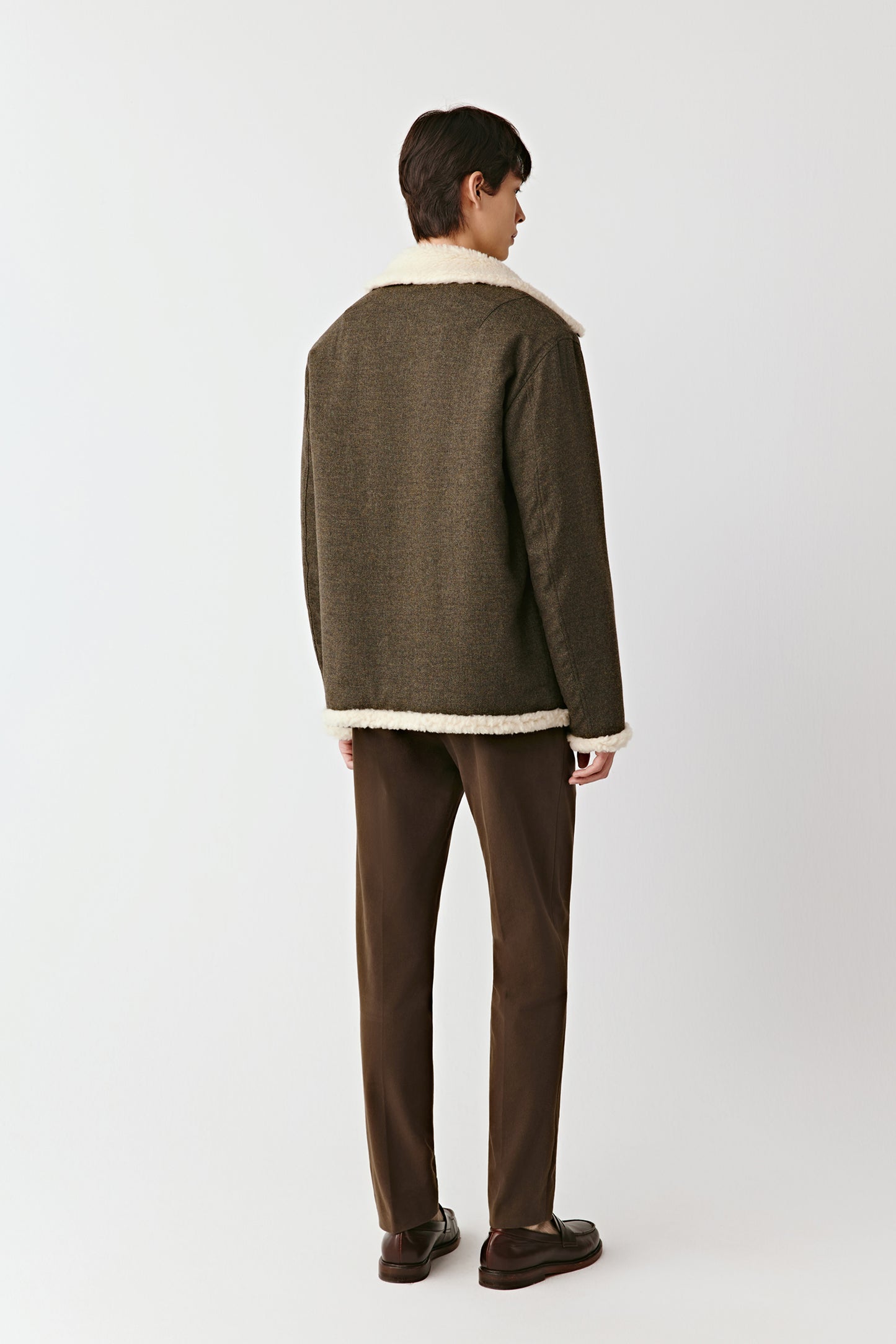 Back view of the wool and cashmere jacket, highlighting the neat seams and clean tailoring.