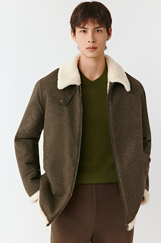 Three-quarter side view of the khaki green zip jacket, showing the structured shape and soft texture of the wool-cashmere blend.