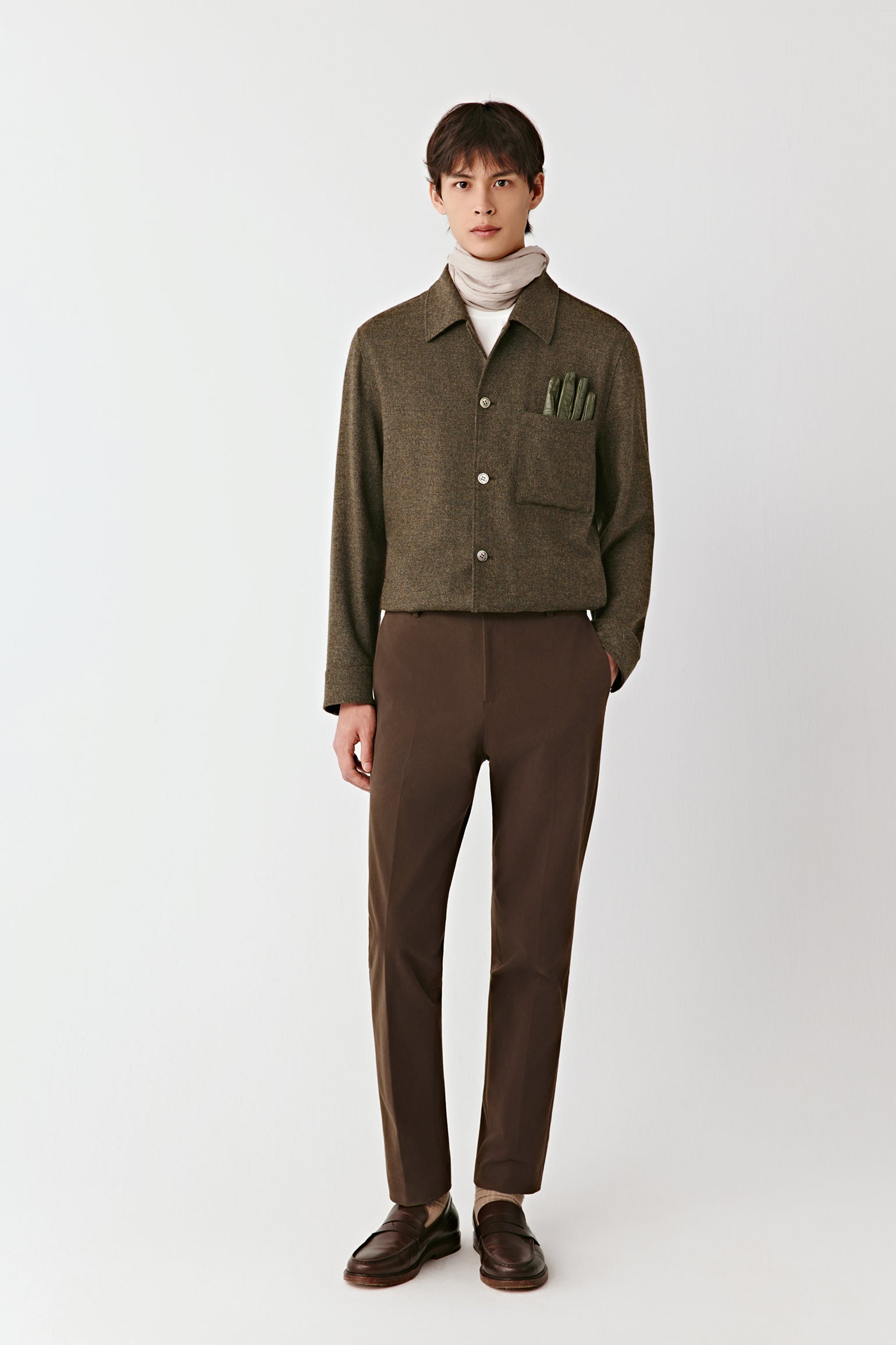 Front view of the khaki green wool and cashmere shirt jacket, featuring a shirt collar, chest patch pocket, and matte buttons.