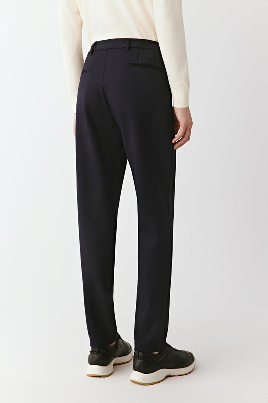 Side view highlighting the straight cut and natural drape of the wool-blend fabric.