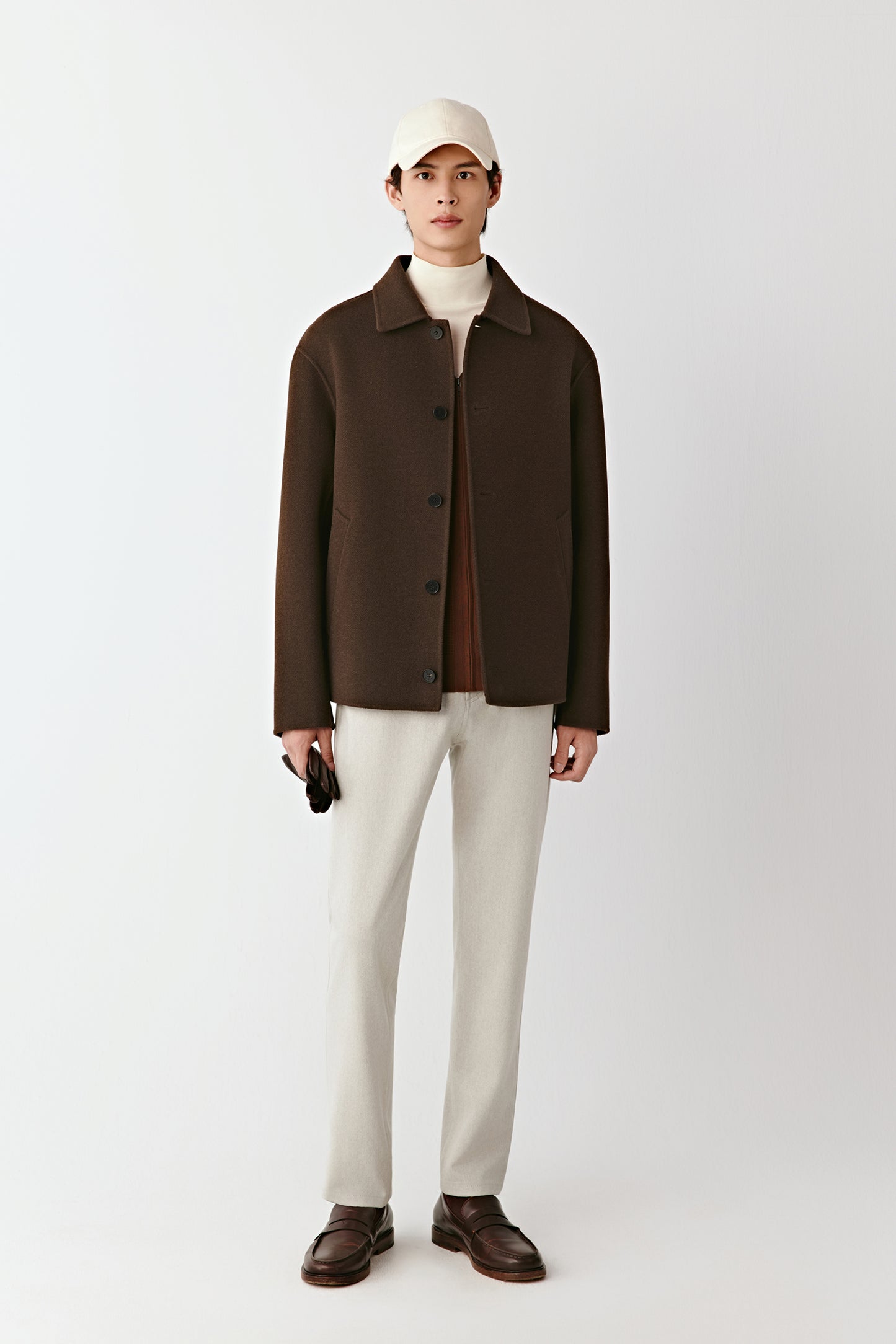 Front view of the chestnut brown double-faced yak wool twill jacket, straight cut with a shirt collar and button closure.