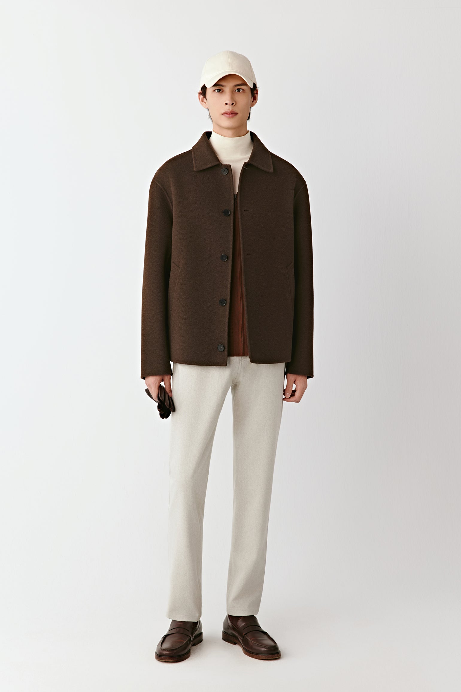 Front view of the chestnut brown double-faced yak wool twill jacket, straight cut with a shirt collar and button closure.