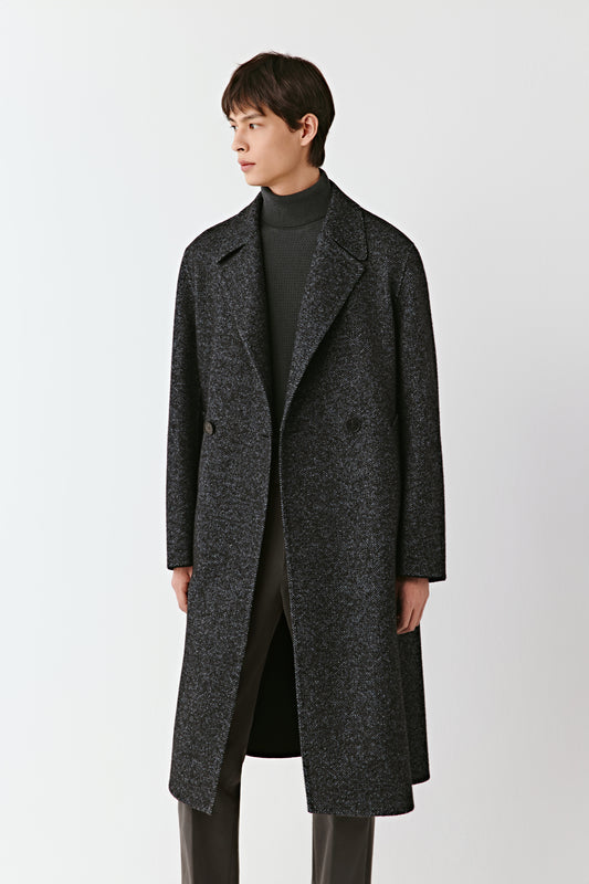 Man wearing a dark gray coat on a white background