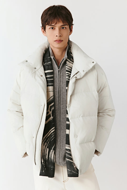 Full-length front view of a cream recycled polyester puffer coat with horizontal quilting, a high stand collar, and a clean, padded silhouette.